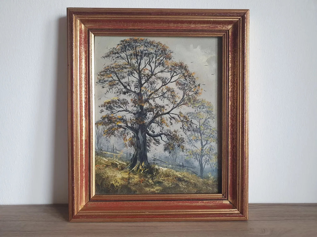 Ölgemälde einer herbstlichen Baumlandschaft, signiert A. Koch, im gold- und rotfarbenen Rahmen