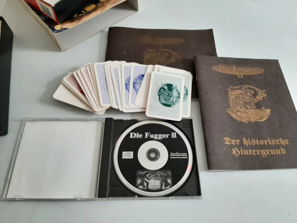 Die Fugger II von Sunflowers – Spiel-CD und beiliegendes Material