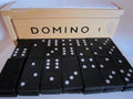 Vollständiges Domino mit schwarzen Spielsteinen, Holzschubkasten und Anleitung