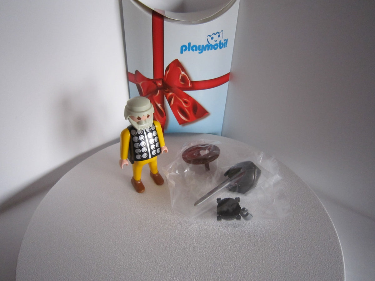 Playmobil-Ritter mit weißem Bart, Zubehör und geöffneter Geschenkverpackung